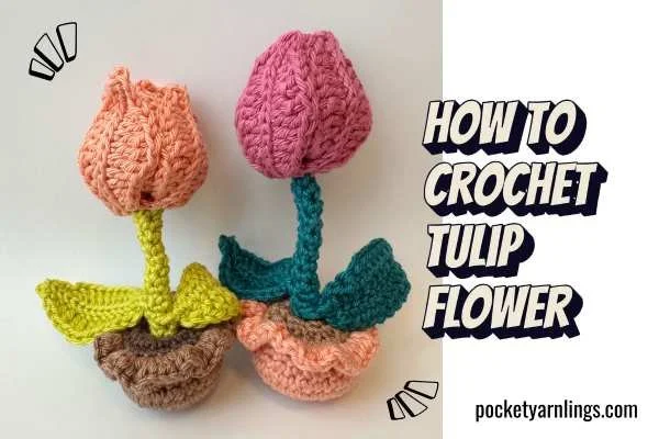 Two crochet tulip flowers in peach and pink with green stems standing in small crochet pots, from Pocket Yarnlings