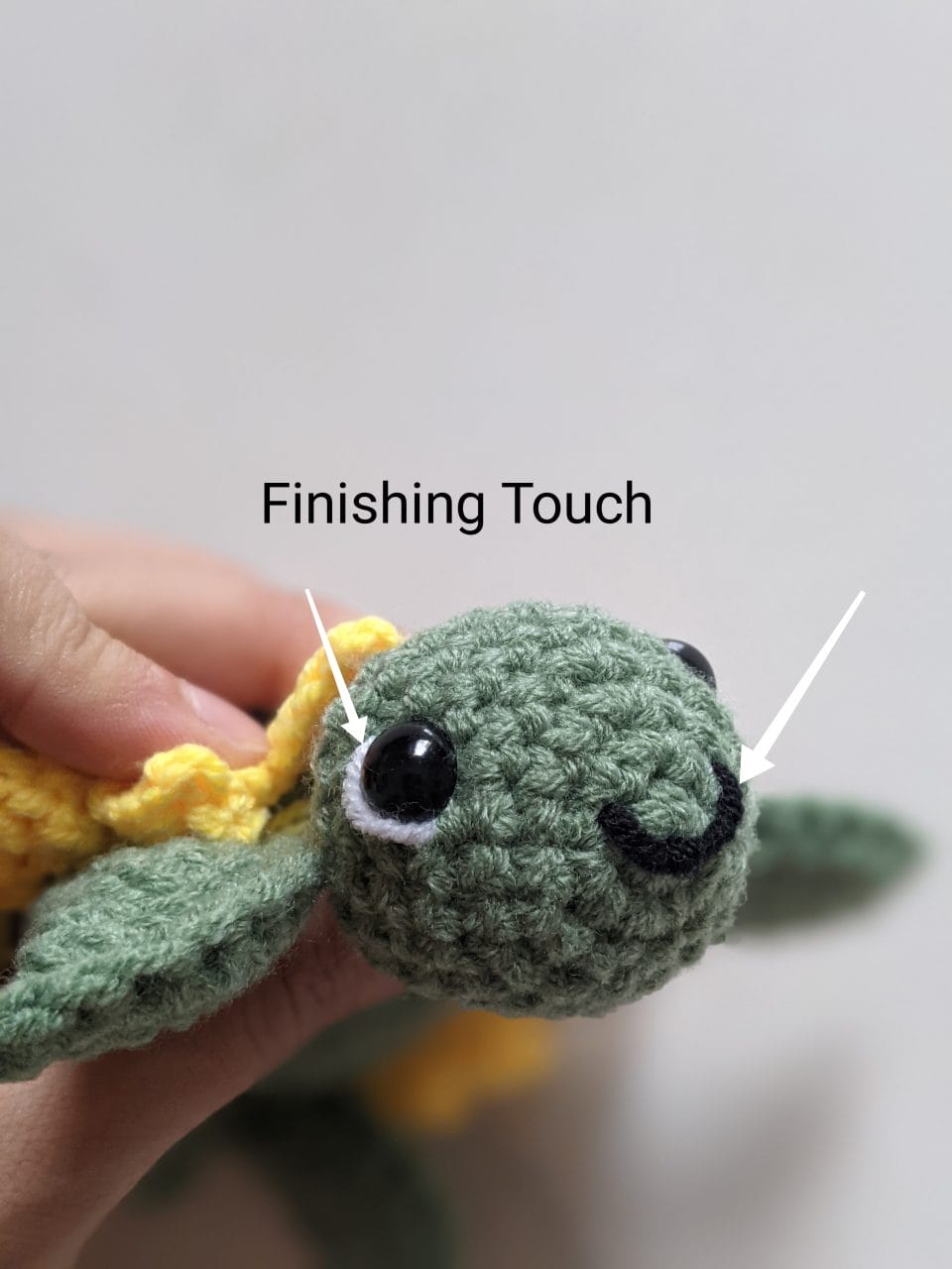 Sunflower turtle with embroidered black smile and white eye highlights added
