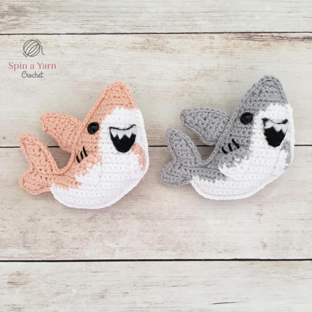 A grey and white crochet shark amigurumi sized for a keyring, by Spin a Yarn Crochet