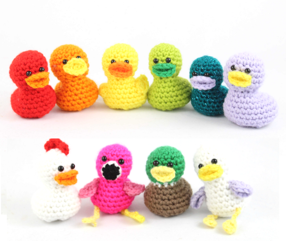 Ten small crochet ducks in rainbow colours plus a chicken, flamingo, mallard and seagull variation, from StringyDingDing
