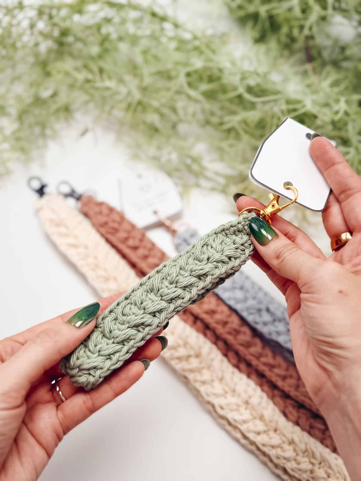 A textured cream crochet wheat stitch keychain strap on a swivel clasp, by Briana K Designs