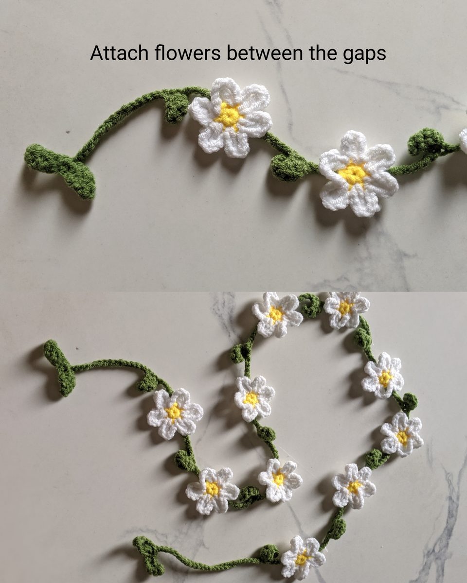 Two photos showing white crochet daisies glued between the leaves of the green vine, then the full garland laid in loops