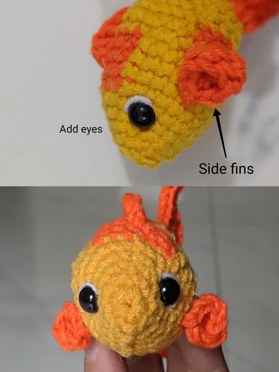 Yellow crochet goldfish with a black safety eye ringed in white and an orange side fin sewn on below it